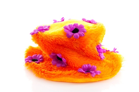 Funny orange hat with purple flowers over white backgroundの写真素材