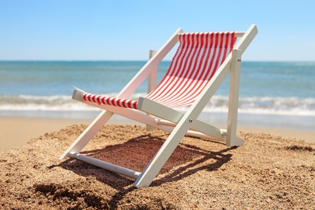 Beach chair near the ocean on sunny dayの写真素材