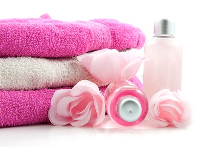 Pink colored spa accessory over white backgroundの写真素材