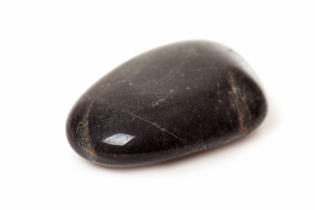one black stone isolated on white background 