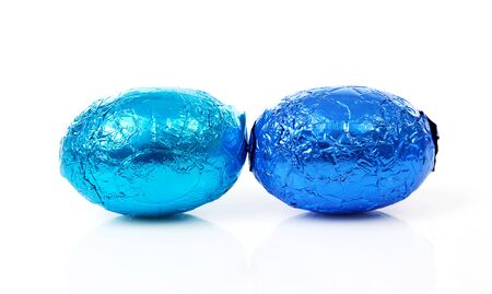 Two blue easter eggs over white backgroundの写真素材