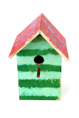 Colorful birdhouse painted by children over white backgroundの写真素材