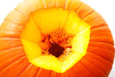 Closeup of hole in pumpkin over whiteの写真素材
