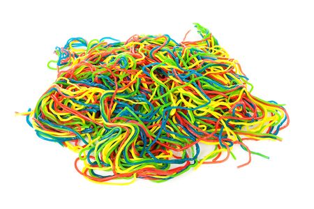 Pile of colorful fruit laces candy over white backgroundの写真素材