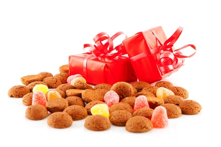 Typical dutch sweets: pepernoten (ginger nuts) and presents for celebration at 5 december in the Netherlands over white backgroundの写真素材
