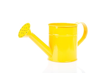 One yellow watering can over white backgroundの写真素材