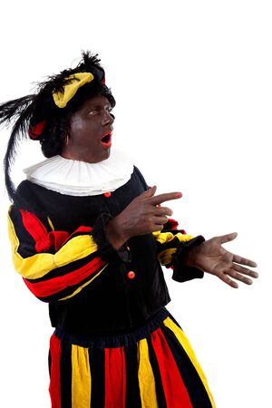 Zwarte piet ( black pete) typical Dutch character part of a traditional event celebrating the birthday of Sinterklaas in december over white background is showingの写真素材