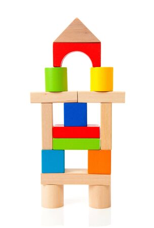House made out of colorful wooden building blocks over white backgroundの写真素材