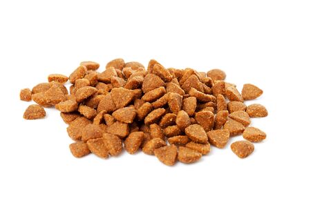 pile of dry cat food over white backgroundの写真素材