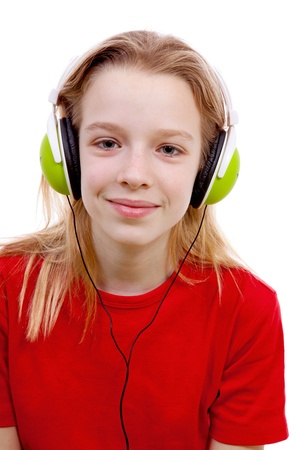 girl is listening to music with headphones on over white backgroundの写真素材