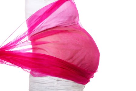 closeup of pregnant belly with pink cloth over white backgroundの写真素材