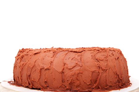 delicious chocolate cake in closeup over white backgroundの写真素材