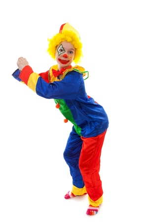 child dressed as colorful funny clown over white backgroundの写真素材