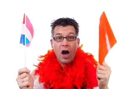Man is posing in orange outfit for soccer game over white backgroundの写真素材