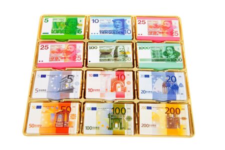 Chocolate Dutch currency in box over white backgroundの写真素材