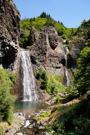 Cascade of Ray Pic France with rainbow, famous waterfall in Ardecheの写真素材