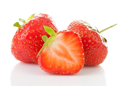 Couple of fresh strawberries in closeup over white backgroundの写真素材