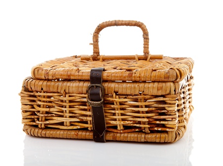 Closed cane basket with strap over white backgroundの写真素材
