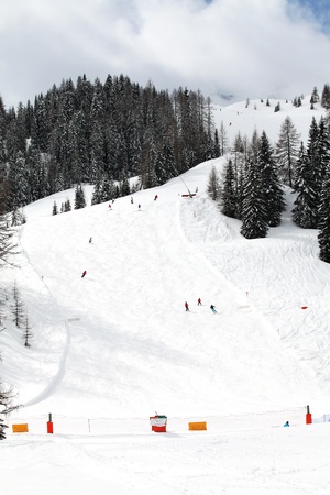 People skiing in the Dolomites of Italyの写真素材