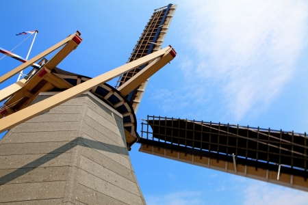 Top of Dutch windmill against blue skyの写真素材