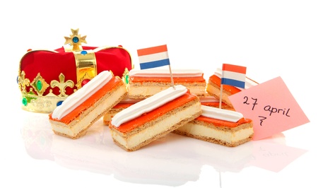 Typical Dutch tompouce sweet with crown over white backgroundの写真素材