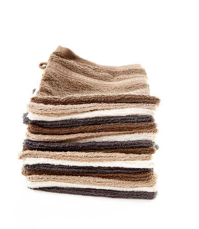 Pile of washcloths isolated on white backgroundの写真素材