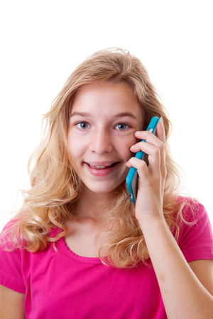 Happy Girl is calling on mobile phone over white backgroundの写真素材