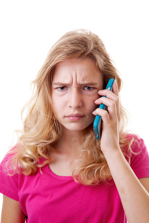 Angry Girl is calling on mobile phone over white backgroundの写真素材