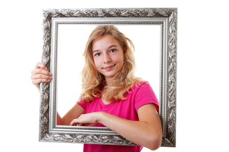 Girl is holding decorated frame over white backgroundの写真素材