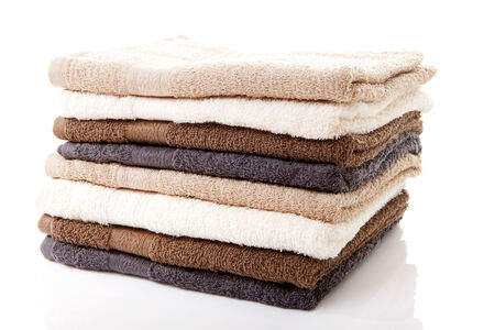 Pile of towels over white backgroundの写真素材