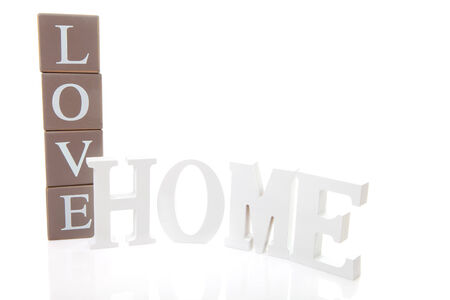 Word Love on blocks and Home in white letters isolatedの写真素材