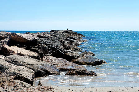 Sunny beach with pier at the south of Franceの写真素材