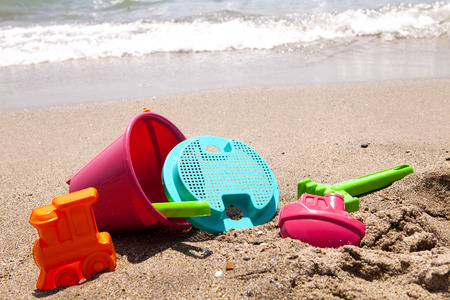 plastic toys on thebeach  near the oceanの写真素材