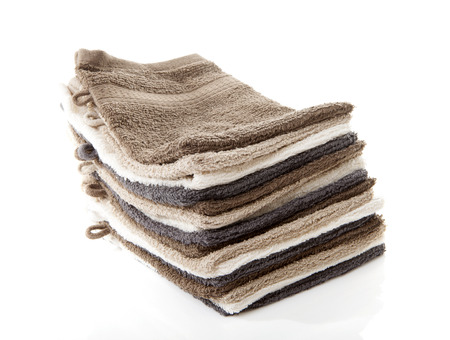 Pile of washcloths isolated on white backgroundの写真素材