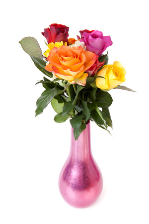 Bouquet of colorful roses in vase over white backgroundの写真素材