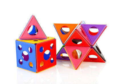 colorful plastic play toy isolated on white の写真素材