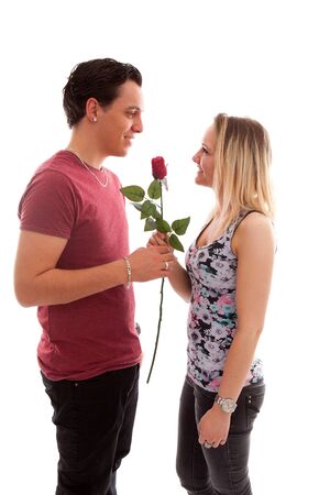 Girl is happy with rose giving by boyfriend over white backgroundの写真素材