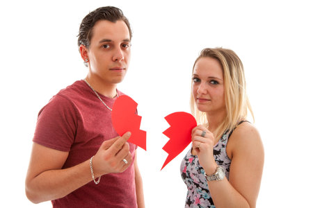 Young couple is breaking up isoalted on white bakgroundの写真素材