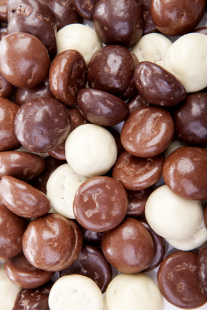 Typical dutch sweets: chocolate pepernoten (ginger nuts) for Sinterklaas; celebration at 5 december in the Netherlands in closeupの写真素材