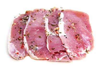 Four pieces of pork meat over white backgroundの写真素材