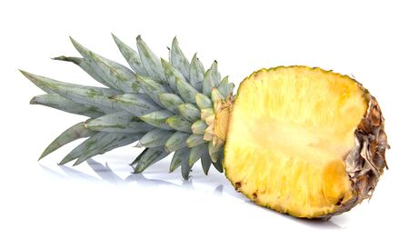 Half cut pineapple in close-up over white backgroundの写真素材