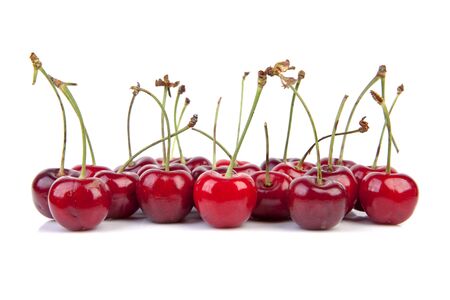 Delicious sweet and ripe red cherries over white backgroundの写真素材