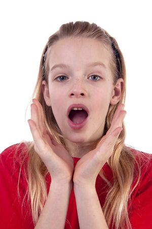 Teenage girl is looking surprised isolated on whiteの写真素材