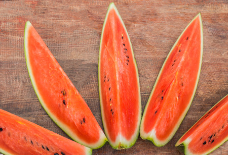 red Watermelon  on old woodの写真素材