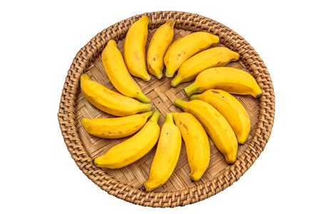 Ripe bananas on a bamboo trayの写真素材