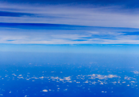Blue sky and Clouds looking from the Airplaneの写真素材