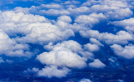 Blue sky and Clouds looking from the Airplaneの写真素材
