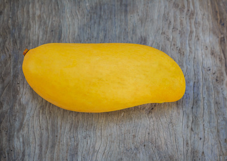 Ripe mango onwoodの写真素材
