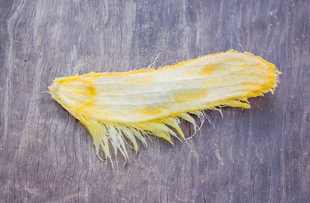 Mango seed on woodの写真素材