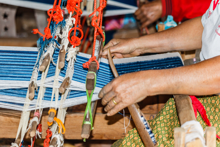 The equipment used in the production of traditional hand woven cotton in  Thailand.の写真素材